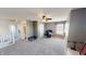 Spacious carpeted bedroom featuring a ceiling fan, and a nearby bathroom at 2441 Longleaf Dr, Greenwood, IN 46143