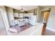 This kitchen offers white cabinetry, wood floors, lots of counter space, and bright natural light at 2441 Longleaf Dr, Greenwood, IN 46143