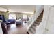 Open floor plan features hardwood flooring and a staircase to the second floor living space at 2441 Longleaf Dr, Greenwood, IN 46143