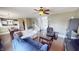Open-concept space with hardwood floors and good light connects the living room, dining area and kitchen at 2441 Longleaf Dr, Greenwood, IN 46143