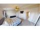 Spacious main bedroom with a comfortable bed, TV, and attached bathroom at 2441 Longleaf Dr, Greenwood, IN 46143