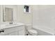 Clean and functional bathroom featuring a single sink vanity, white fixtures, and a tub-shower combo at 2712 Glade Ave, Plainfield, IN 46168