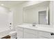 Clean and modern bathroom with a white vanity, large mirror, and shower-tub combination at 2712 Glade Ave, Plainfield, IN 46168