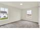Sunny bedroom with neutral carpet, bright windows, and a modern design for comfortable living at 2712 Glade Ave, Plainfield, IN 46168