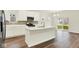Modern kitchen features white cabinets, stainless steel appliances, and center island with quartz countertop at 2712 Glade Ave, Plainfield, IN 46168