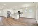 Spacious kitchen with white cabinets, stainless steel appliances, and a large island, ideal for cooking at 2712 Glade Ave, Plainfield, IN 46168