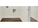 Functional laundry area with wood-look flooring and modern hookups for washer and dryer at 2712 Glade Ave, Plainfield, IN 46168