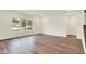 Bright living room with large windows, and vinyl plank flooring at 2712 Glade Ave, Plainfield, IN 46168