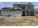 Charming new two-story home with attached two-car garage, craftsman-style columns, and appealing neutral color scheme at 2724 Glade Ave, Plainfield, IN 46168