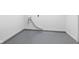 Unfinished basement space with hook ups and gray painted floor at 2833 Hervey St, Indianapolis, IN 46203
