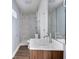 Updated bathroom with a vanity, marble tiled shower, and newer fixtures at 2833 Hervey St, Indianapolis, IN 46203