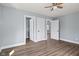 This bedroom features three doors and updated luxury vinyl plank flooring at 2833 Hervey St, Indianapolis, IN 46203