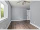 This neutral bedroom features newer windows and updated luxury vinyl plank flooring at 2833 Hervey St, Indianapolis, IN 46203