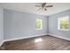 This cozy bedroom features newer windows, neutral paint, and luxury vinyl plank flooring at 2833 Hervey St, Indianapolis, IN 46203