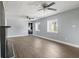 Bright living room with hardwood flooring, a modern fireplace, and large windows at 2833 Hervey St, Indianapolis, IN 46203