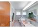 Vintage bathroom with unique tile flooring, a pink sink, and charming window treatments at 3303 Busy Bee Ln, Indianapolis, IN 46227