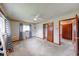 Bedroom with Chevron curtains, built-in closet, and open doorway at 3303 Busy Bee Ln, Indianapolis, IN 46227