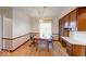 Dining room features a wood table set and built in wood cabinet space, lit by a decorative light fixture at 3303 Busy Bee Ln, Indianapolis, IN 46227