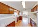 Functional kitchen with white countertops and wood cabinets at 3303 Busy Bee Ln, Indianapolis, IN 46227