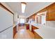 Open kitchen with wood cabinets, solid countertops, an eat in dining space, and wood flooring at 3303 Busy Bee Ln, Indianapolis, IN 46227