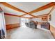 Bright living room featuring wood beams, large windows, and a sliding glass door at 3303 Busy Bee Ln, Indianapolis, IN 46227