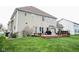 Well-maintained backyard features a spacious deck, green lawn and ample space for outdoor activities at 3389 Grant Ct, Columbus, IN 47203