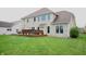Spacious backyard with a well-maintained lawn and a large deck, perfect for outdoor entertaining at 3389 Grant Ct, Columbus, IN 47203