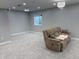 Finished basement features comfortable seating, carpeted floor, and ambient lighting at 3389 Grant Ct, Columbus, IN 47203