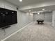 Spacious finished basement offers a pool table, large TV screen, and neutral tones at 3389 Grant Ct, Columbus, IN 47203