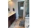 Bathroom view of the sink vanity, doorway and shower at 3389 Grant Ct, Columbus, IN 47203