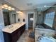 Modern bathroom with double sink vanity, glass shower, and soaking tub at 3389 Grant Ct, Columbus, IN 47203