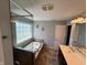 Bathroom featuring a soaking tub with tile surround and separate glass shower at 3389 Grant Ct, Columbus, IN 47203