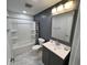 Bathroom features a vanity with sink, mirror, toilet, and bathtub with shower at 3389 Grant Ct, Columbus, IN 47203