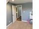 Neutral bedroom features a small vanity and open door to a bathroom at 3389 Grant Ct, Columbus, IN 47203