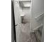 Walk-in closet with shelving, carpet, and a partially open white door at 3389 Grant Ct, Columbus, IN 47203