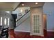 Bright foyer features hardwood floors, natural light and a staircase, creating an inviting entrance at 3389 Grant Ct, Columbus, IN 47203