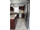 Modern kitchen boasting granite countertops, stainless steel appliances, dark cabinetry, and a central island at 3389 Grant Ct, Columbus, IN 47203