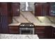 Kitchen with modern stainless steel stove and granite countertops at 3389 Grant Ct, Columbus, IN 47203