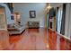 Bright living room with hardwood floors, sofas, fireplace, large windows, and high ceilings at 3389 Grant Ct, Columbus, IN 47203