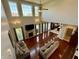 Open-concept living room with fireplace, large windows, high ceilings, and hardwood floors at 3389 Grant Ct, Columbus, IN 47203