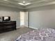 Calming main bedroom with dark wood furniture, flat screen tv and access to other rooms at 3389 Grant Ct, Columbus, IN 47203