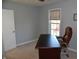 Office with a desk, rolling chair, window, and door at 3389 Grant Ct, Columbus, IN 47203