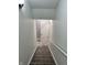 Staircase with carpeted steps and a white handrail at 3389 Grant Ct, Columbus, IN 47203