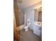 Clean bathroom featuring a shower with tub, modern toilet, and a simple sink vanity at 419 W Osage St, Greenfield, IN 46140