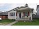 Inviting home featuring a covered front porch, ideal for unwinding outdoors at 419 W Osage St, Greenfield, IN 46140