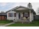 Charming home featuring a cozy front porch perfect for enjoying quiet mornings and relaxing evenings at 419 W Osage St, Greenfield, IN 46140
