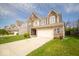 Beautiful home featuring a manicured lawn, brick facade, and a convenient two-car garage at 4622 Crosby Buck Dr, Indianapolis, IN 46237