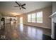 Spacious living room with fireplace, flowing into a modern kitchen and dining area at 4622 Crosby Buck Dr, Indianapolis, IN 46237