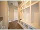 Organized mudroom with built-in shelving, bench seating, and ample storage space at 4622 Crosby Buck Dr, Indianapolis, IN 46237