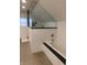 Modern bathroom featuring a soaking tub, glass-enclosed shower, and sleek fixtures at 4815 Carrollton Ave, Indianapolis, IN 46205